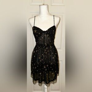 Black mini dress w gold starfishes. Similar to Show me your mumu starfish dress.